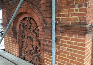 dragon motif victorian brick facade norman shaw architect london