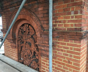 dragon motif victorian brick facade